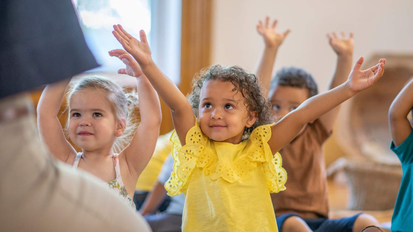 Young children participating in a joyful kids yoga and mindfulness class at Sunshine Yoga for Kids in Discovery Bay, Hong Kong.