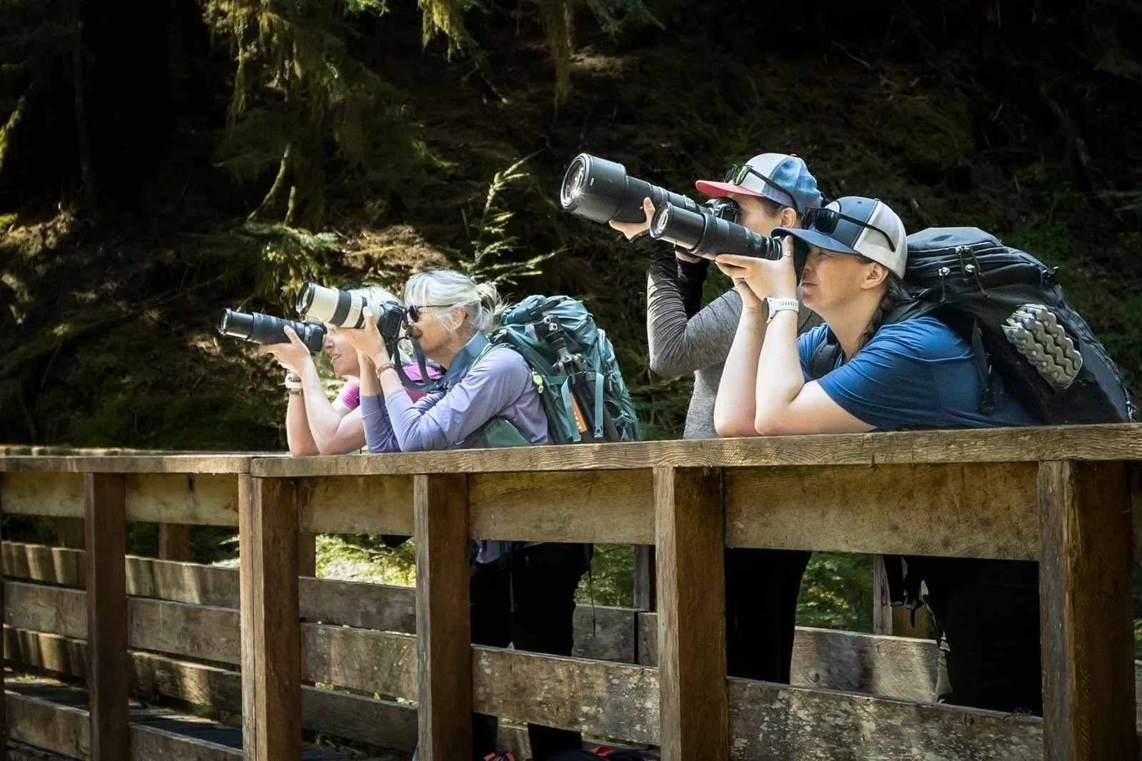 Workshop participants shooting from a bridge.