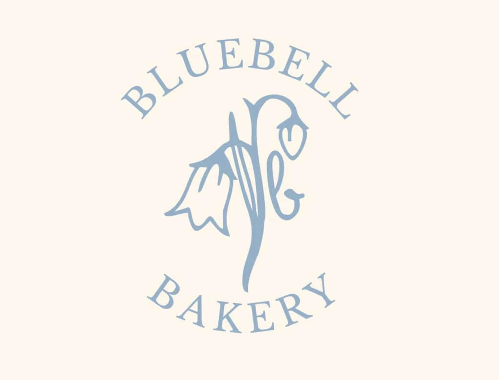 Logo of Bluebell Bakery with a stylized bluebell flower in the center surrounded by the words 'Bluebell Bakery' in a circular arrangement.