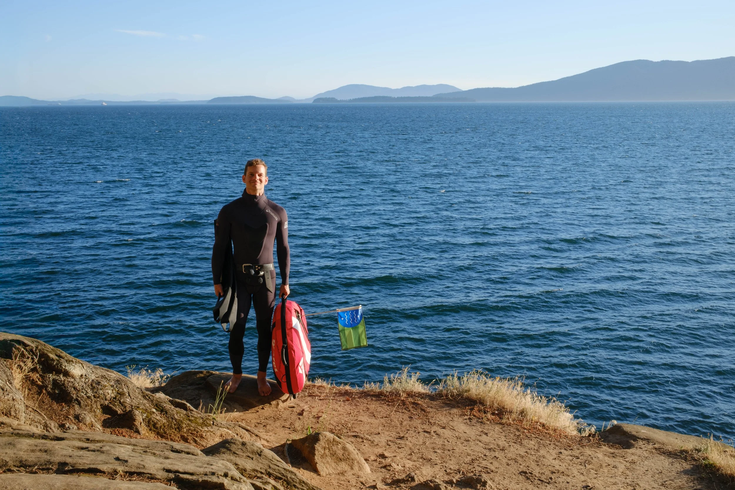 Freediver with Bellingham Bay and Lummi island in the background.