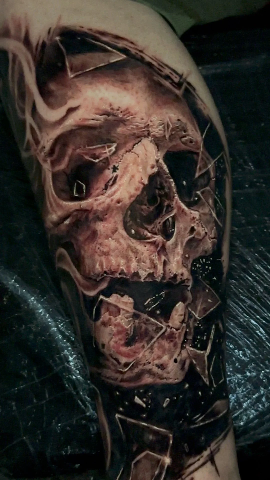 realistic skull tattoo Grimm reaper decomposing zombie skull peeling skin, missing flesh, exposed bone, surrounded broken glass tattoo art skullart skulls coverup tattoo Reaper dead realism tattooart best skull tattooist tattooer  coverup tattoo spec