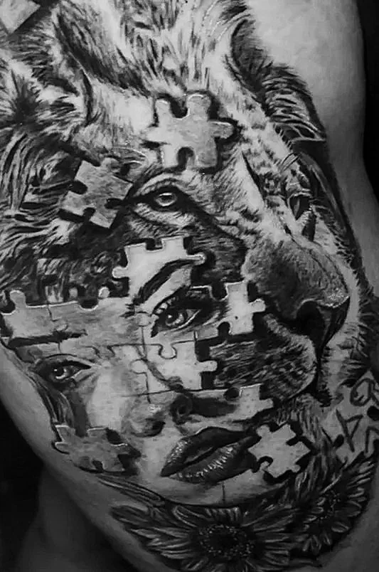 Tattoo lion, woman's face, puzzle pieces. Surrealism tatts procreate design pinterest design strength woman's power ink inked woman thigh piece thigh tattoos black and grey  tattoo art artist greatist great best better than yours beautiful woman tat