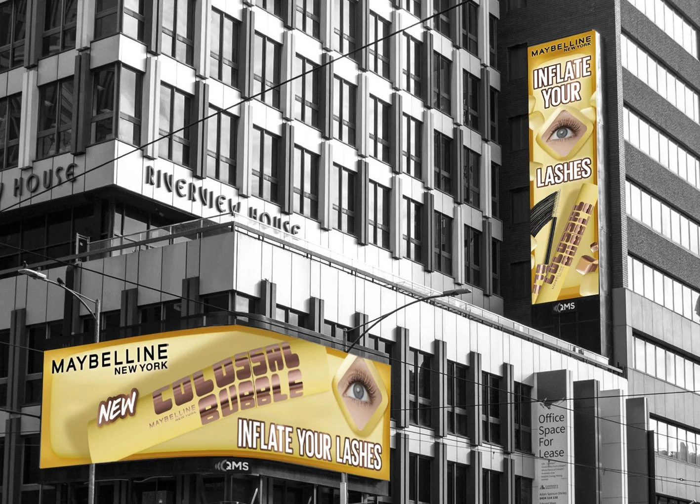 Digital billboards on a building advertising Maybelline New York's new lash product, with the slogan "Inflate Your Lashes" and an image of an eye with long eyelashes, in a city setting.