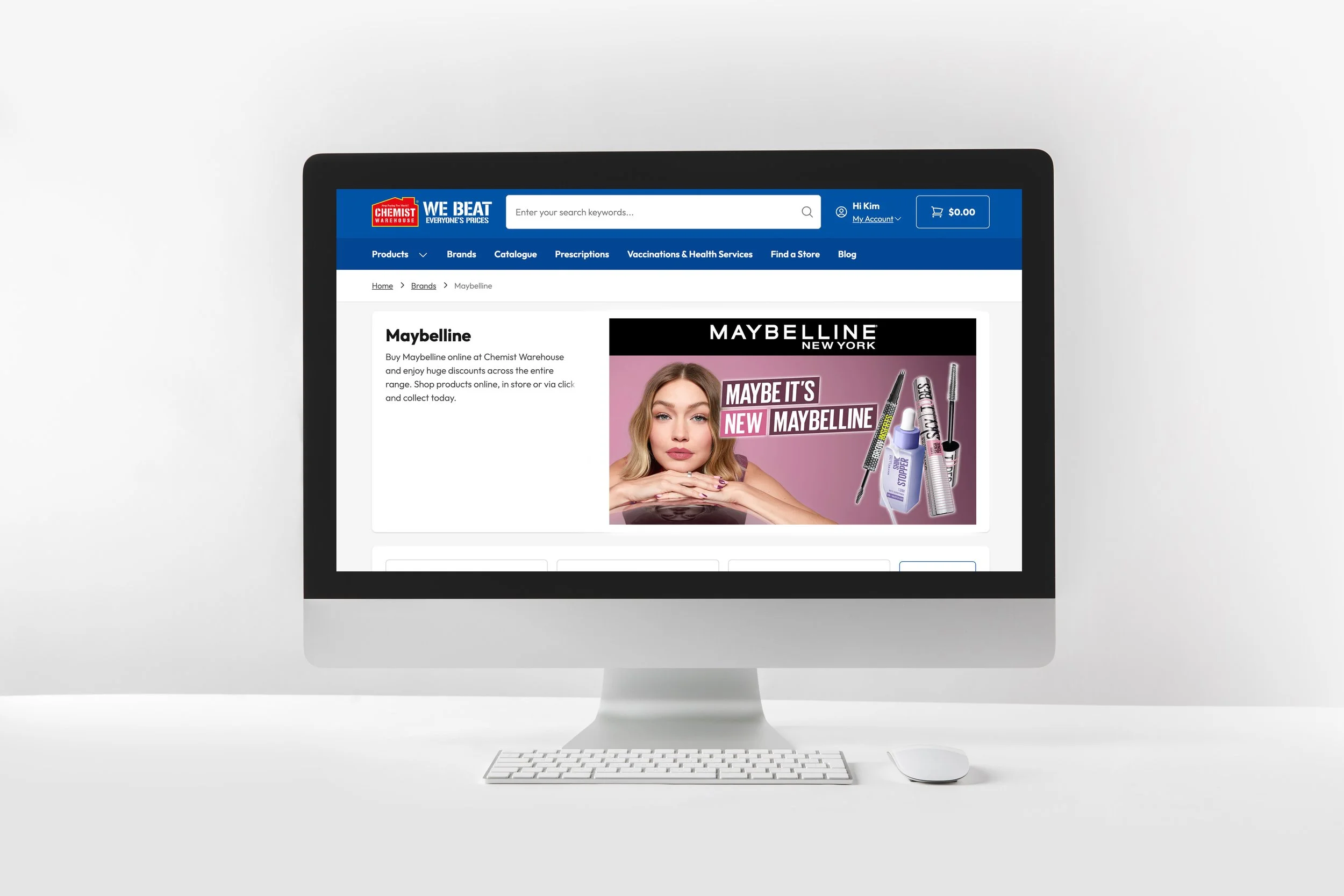 An iMac computer displaying a website for Chemist Warehouse, featuring a Maybelline advertisement with a woman and makeup products.