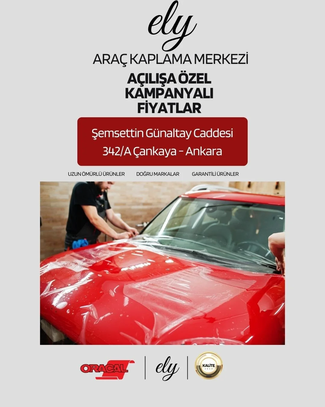 Advertisement for Ely vehicle wrap center with special opening campaign and prices, showing a person wrapping a red car.