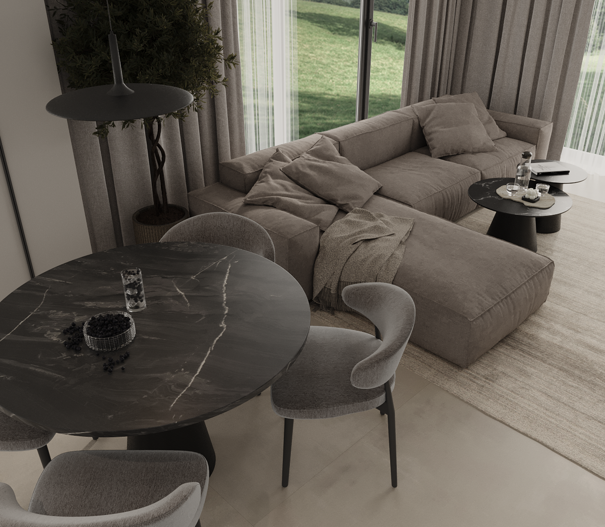 A modern living room with a gray sectional sofa, beige pillows, and a throw blanket. There's a round black coffee table with water bottles, glasses, and decorative items. A large sliding glass door with curtains opens to a grassy outdoor area. Adjacent is a black marble dining table with gray upholstered chairs, a bowl of berries, and a glass of water. A tall lamp and a potted plant are also visible.