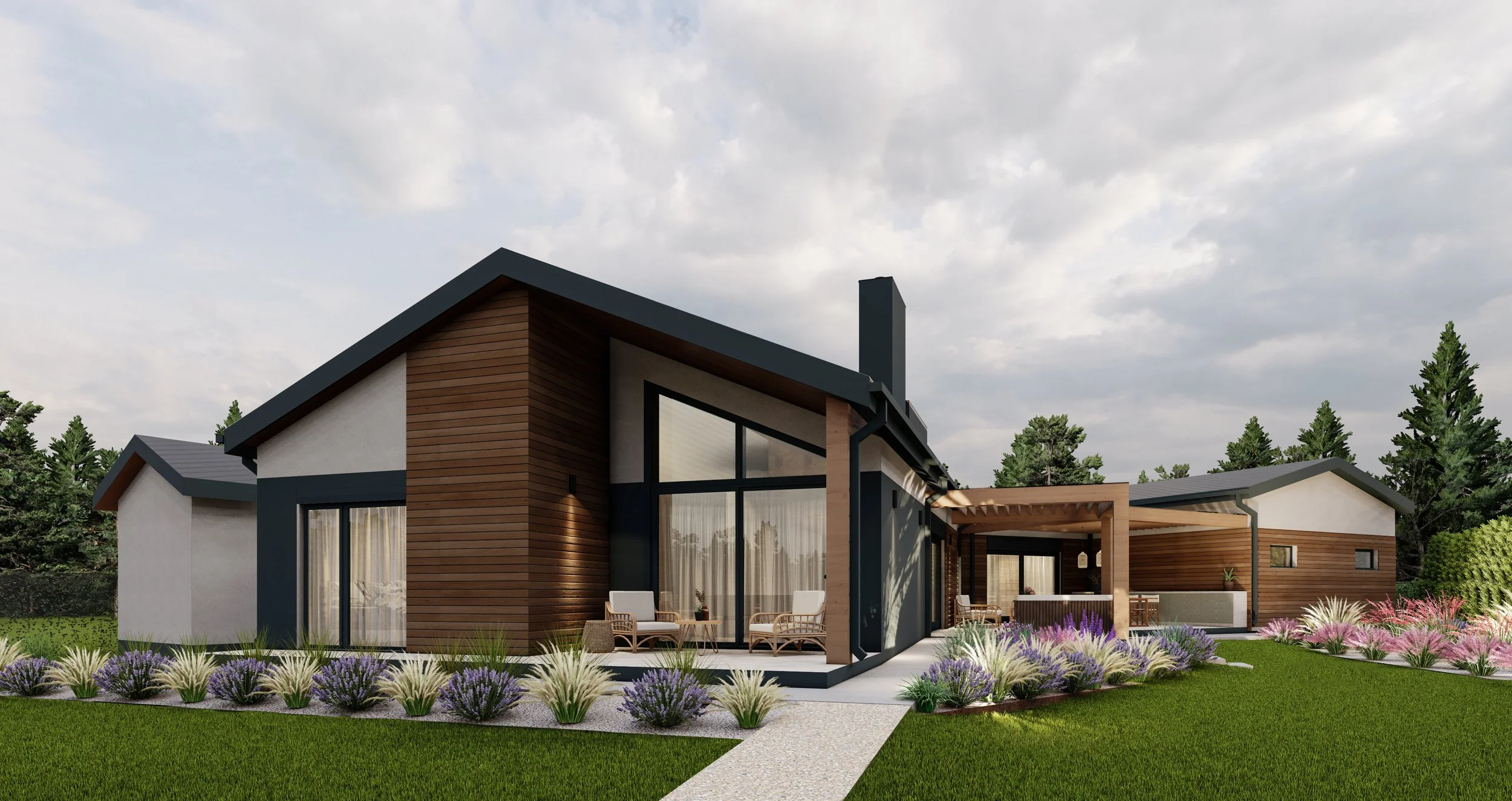 Modern single-story house with white and wood exterior, large windows, front porch with seating area, surrounded by landscaped garden with purple and beige plants, green lawn, trees, and a cloudy sky.