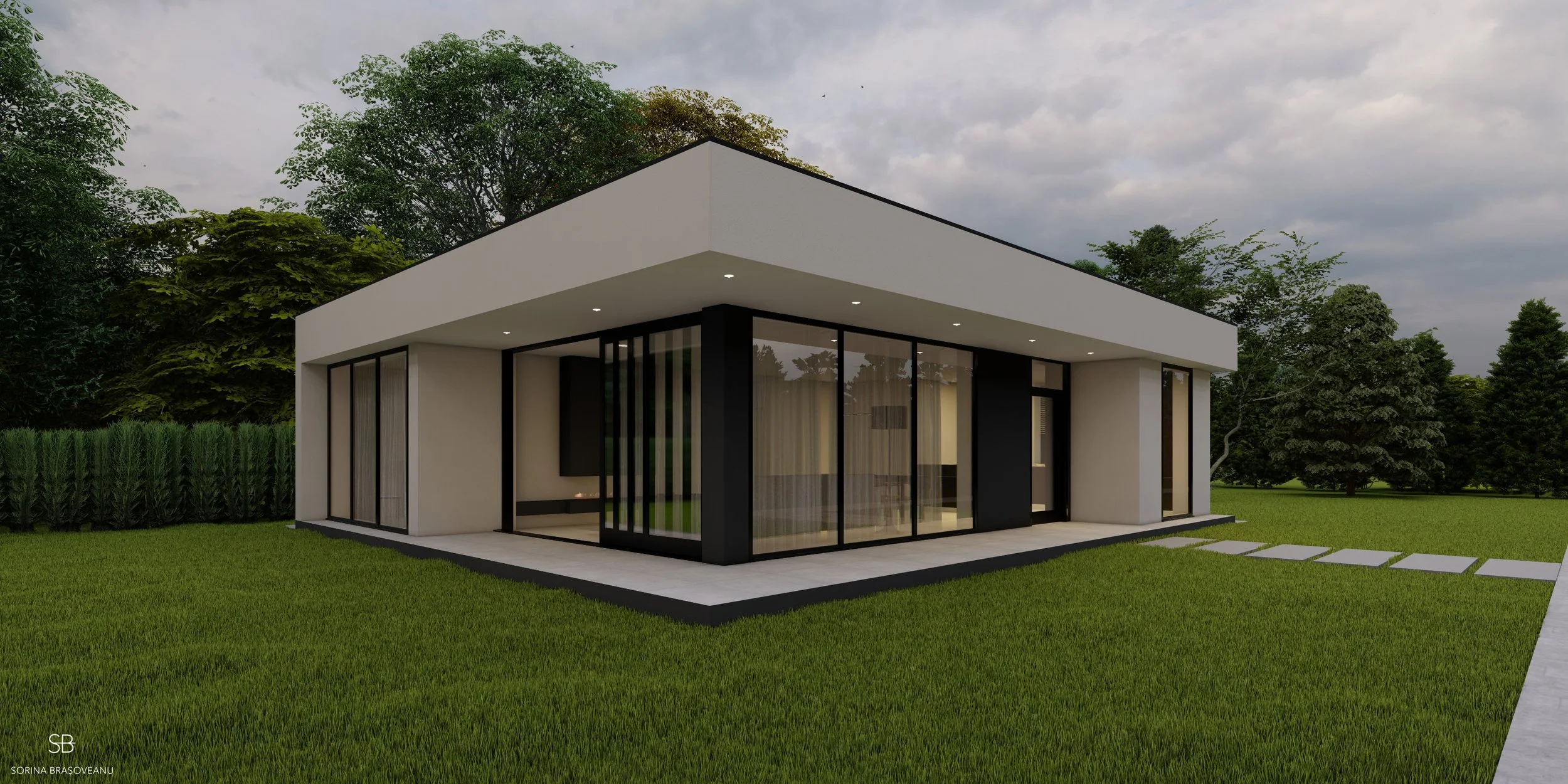 Modern single-story house with large glass windows and a flat roof, surrounded by a green lawn and trees, with a pathway leading to the entrance.