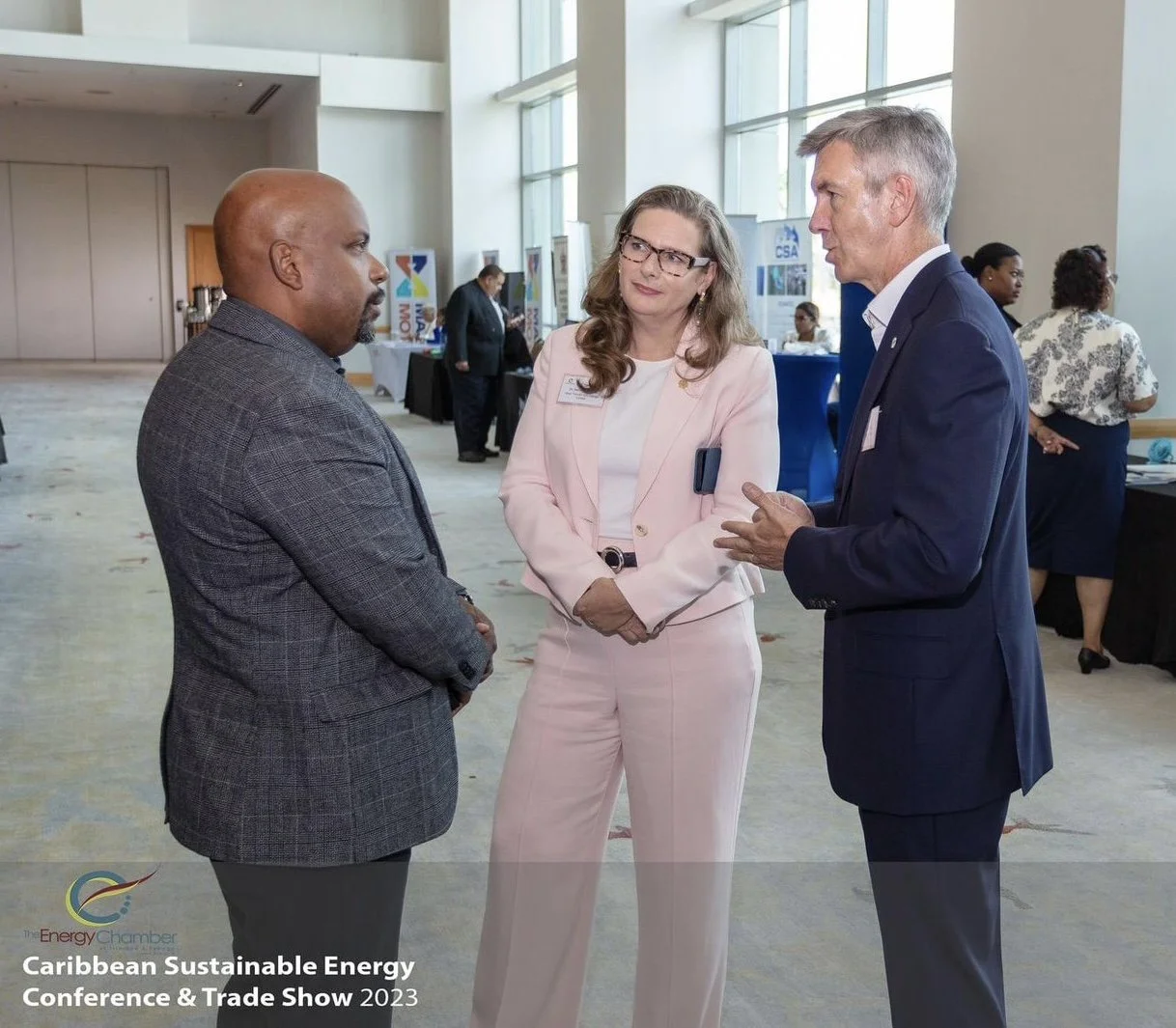 Samantha Meehan in discussion with BP executives at the Caribbean Sustainable Energy Conference & Trade Show 2023