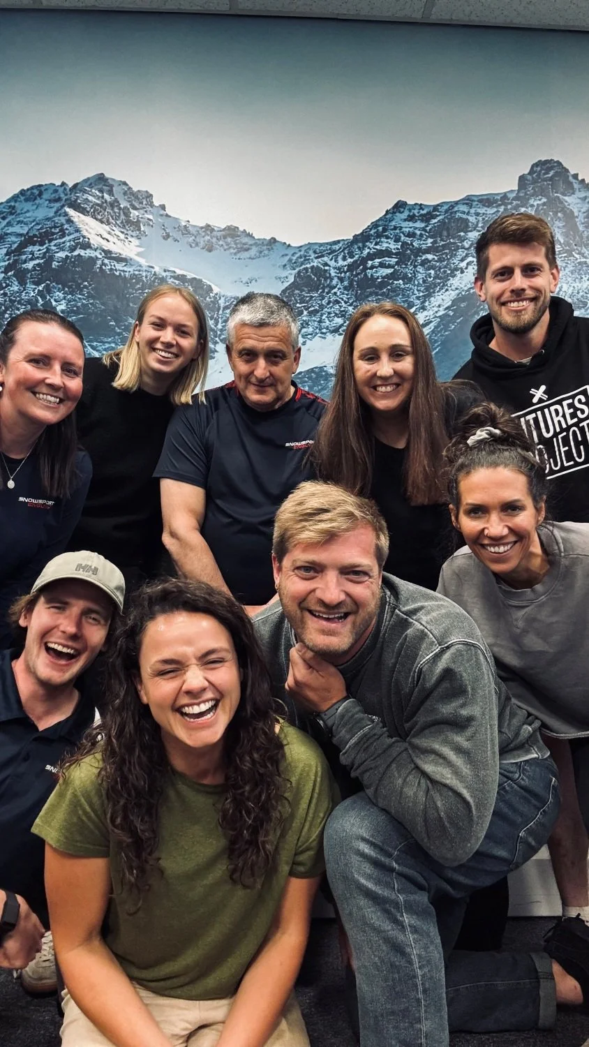 A group of male and female Snowsport England staff members