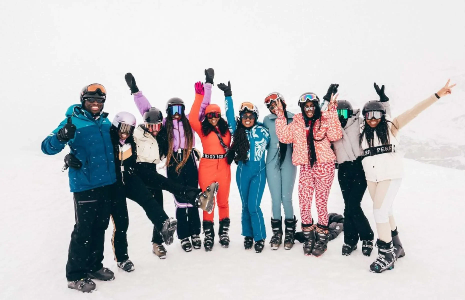 A group of male and female skiers in the snow