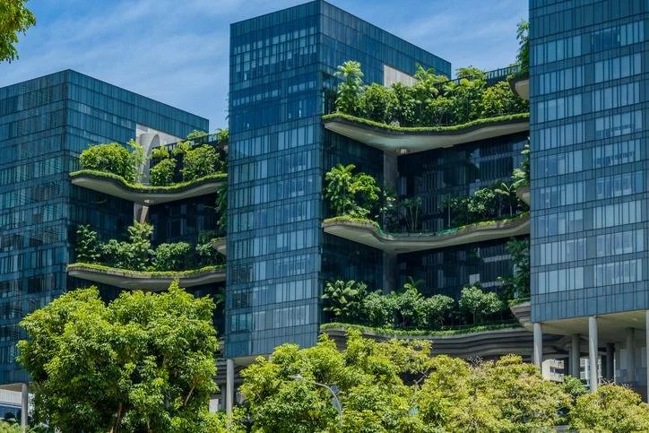 Green Mark certified sustainable building facade with integrated greenery and energy efficient design