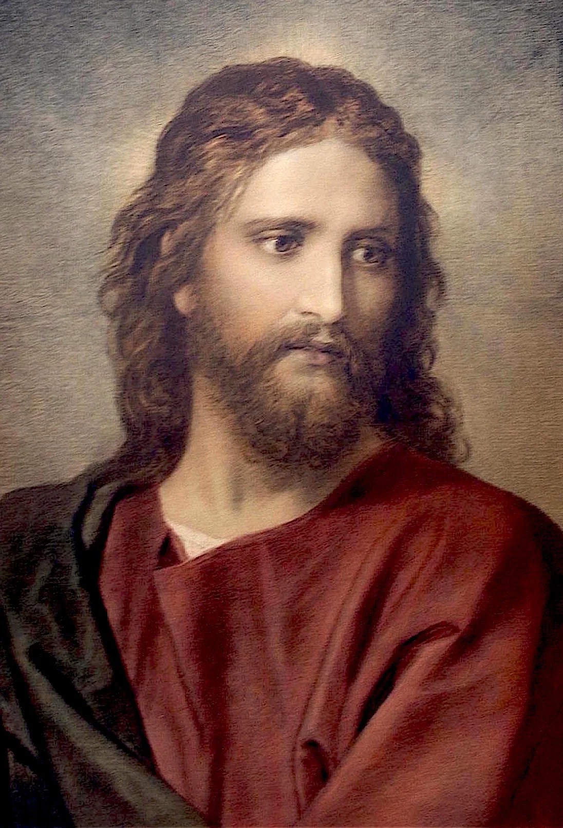 Imagen de un retrato pintado de Jesús con barba y cabello largo, usando túnica roja y capa negra, mirando hacia su izquierda.