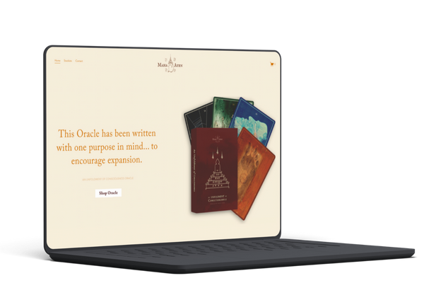 Laptop displaying a website with Oracle tarot card decks and a message about encouragement and expansion.