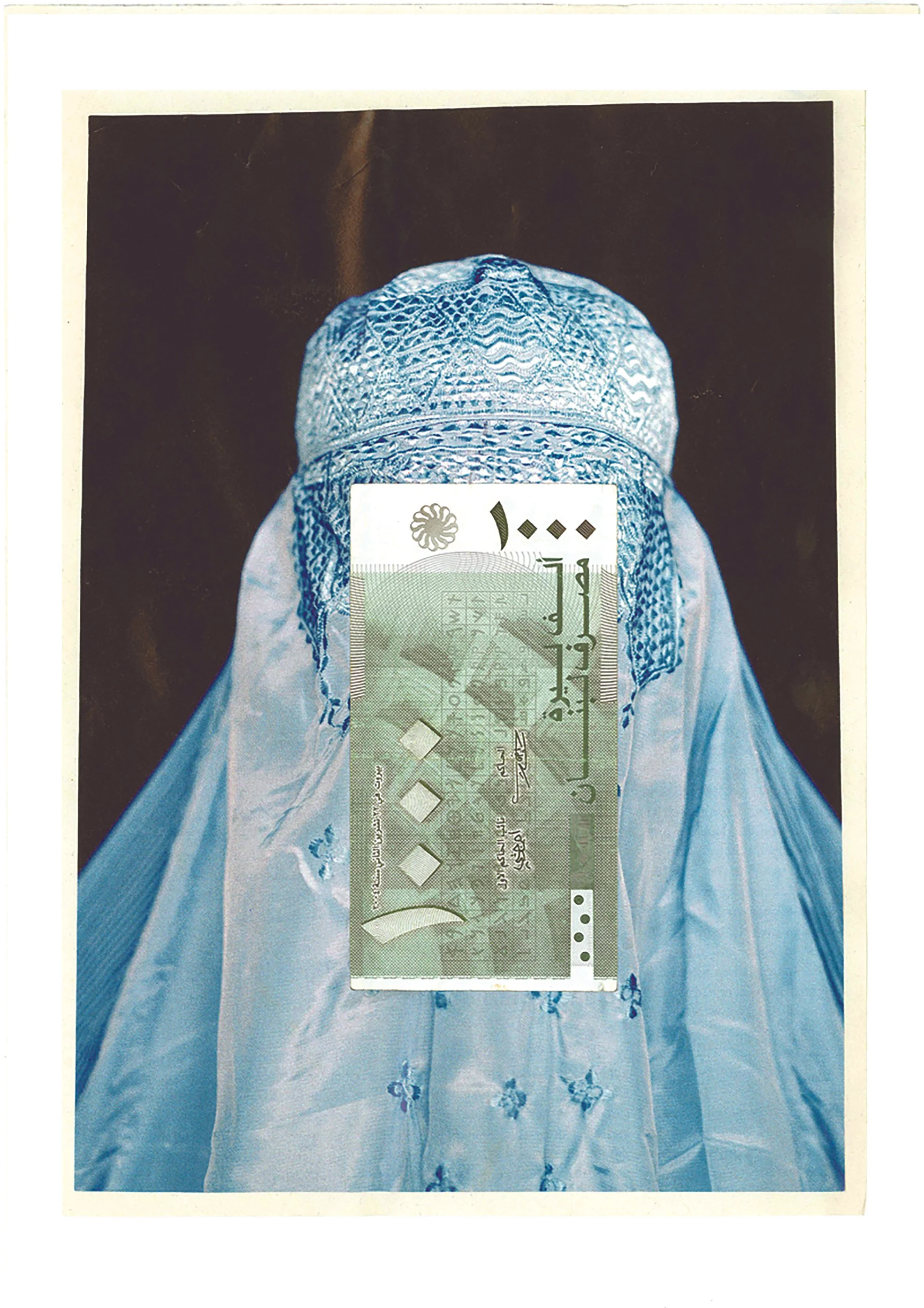 A photograph of a woman wearing traditional Middle Eastern attire, including a light blue head covering and a matching dress with embroidery. A Saudi 50 riyal banknote is placed over her face.