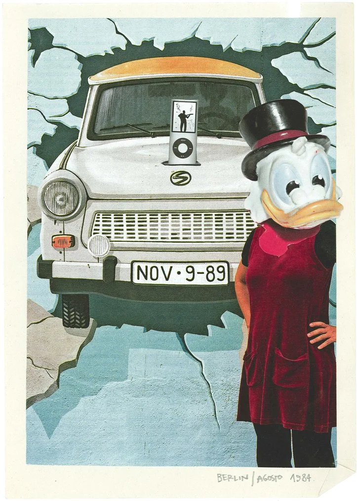 A wall mural shows a vintage white van crashing through a wall with cracks. The mural includes a small image of a person on a music player on the van's hood. A woman wearing a Donald Duck mask, a black top hat with a red band, and a red velvet dress 