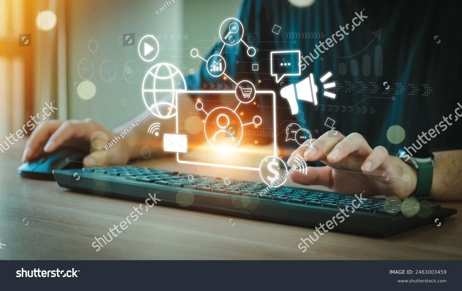 Person using a computer keyboard with digital icons and symbols representing digital marketing, online shopping, social media, and communication floating above the keyboard.