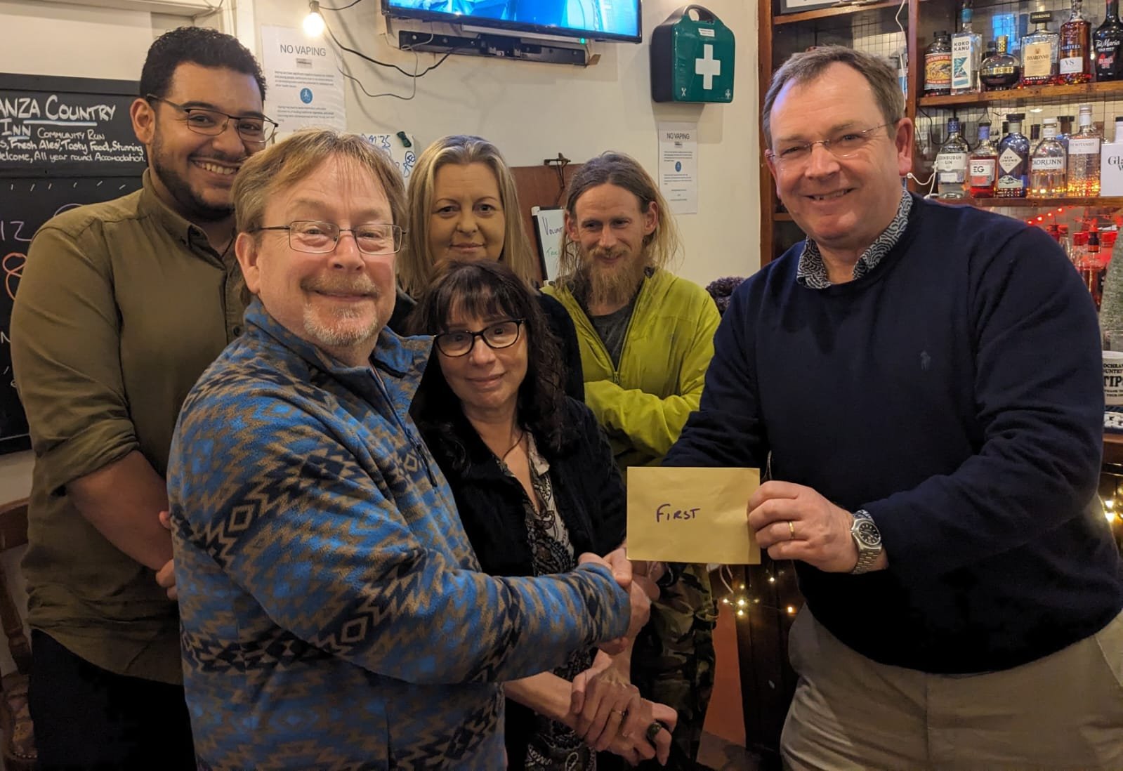 winning quiz team accepting their prize