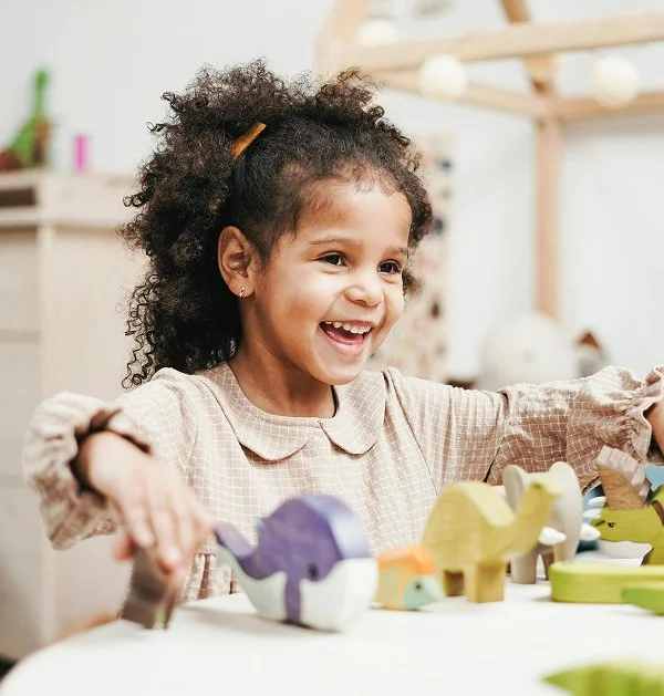 A young girl smiling