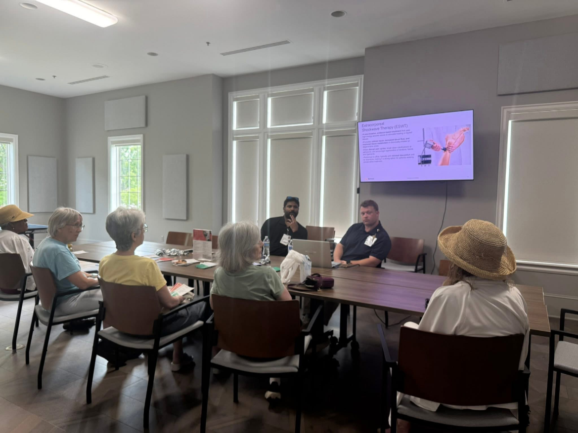 Presenter leading a healthcare education session for attendees