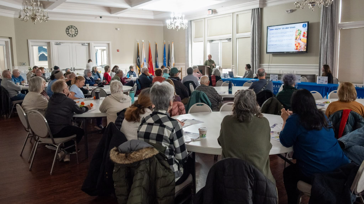 Audience attending a presentation on strategies for aging well