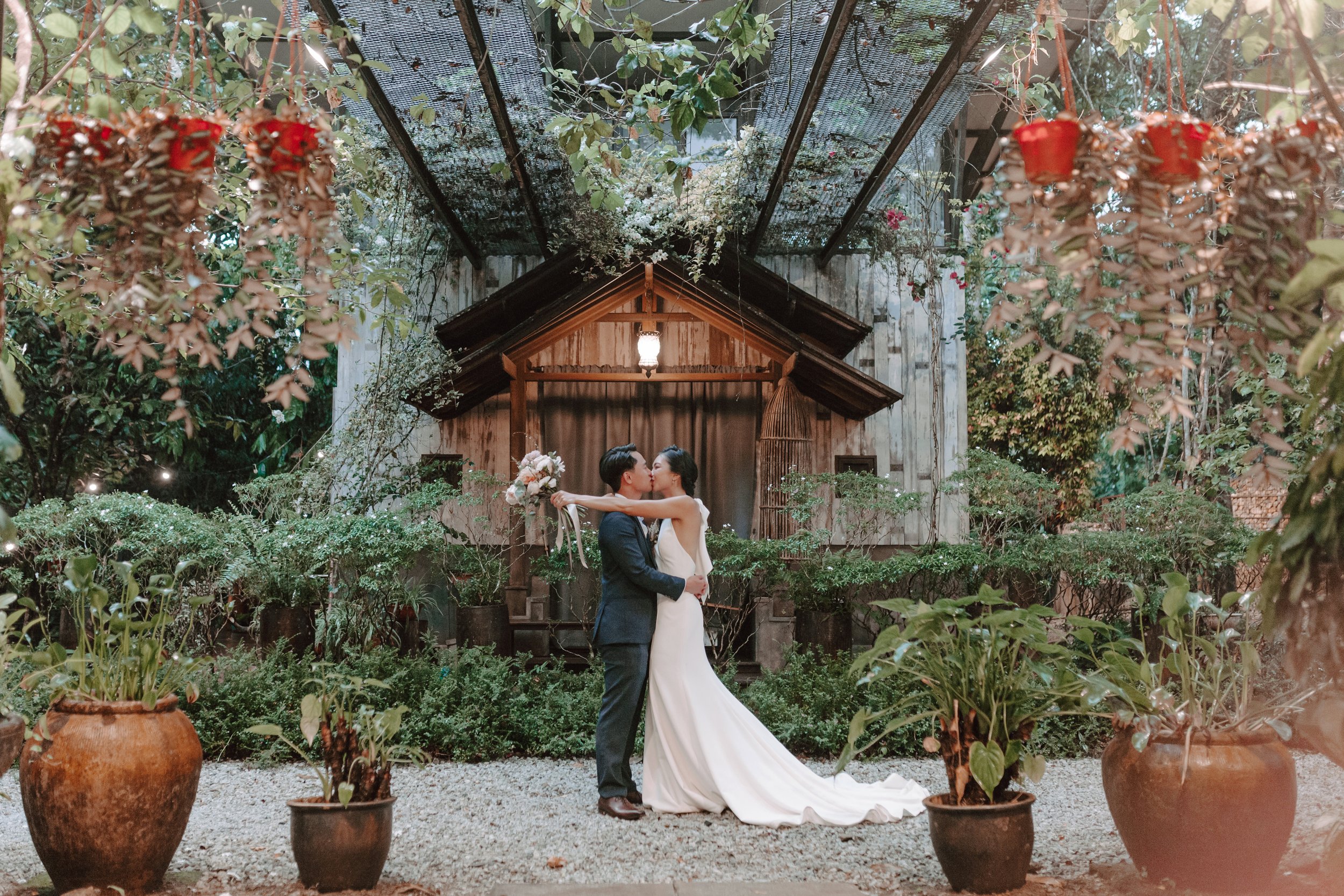 The day began bright and calm with a meaningful tea ceremony, while gentle rain arrived in the evening—leading the celebration indoors for heartfelt vows and a joyful wedding dinner at Ratu Rening Residency.