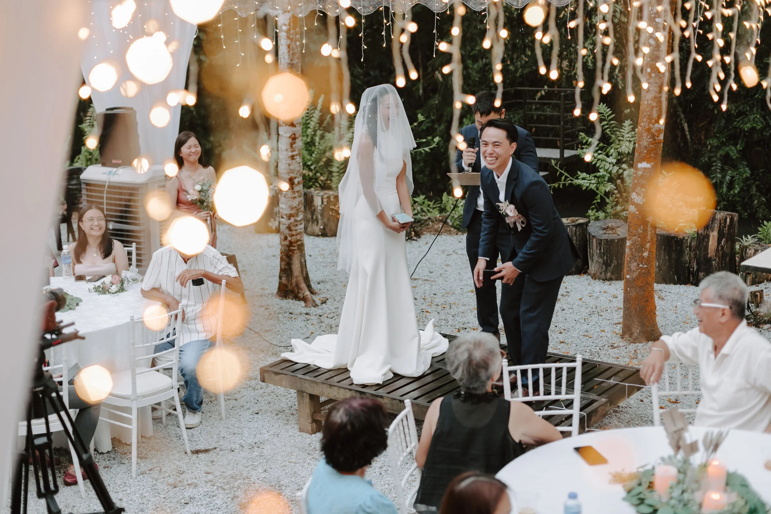 The day began bright and calm with a meaningful tea ceremony, while gentle rain arrived in the evening—leading the celebration indoors for heartfelt vows and a joyful wedding dinner at Ratu Rening Residency.