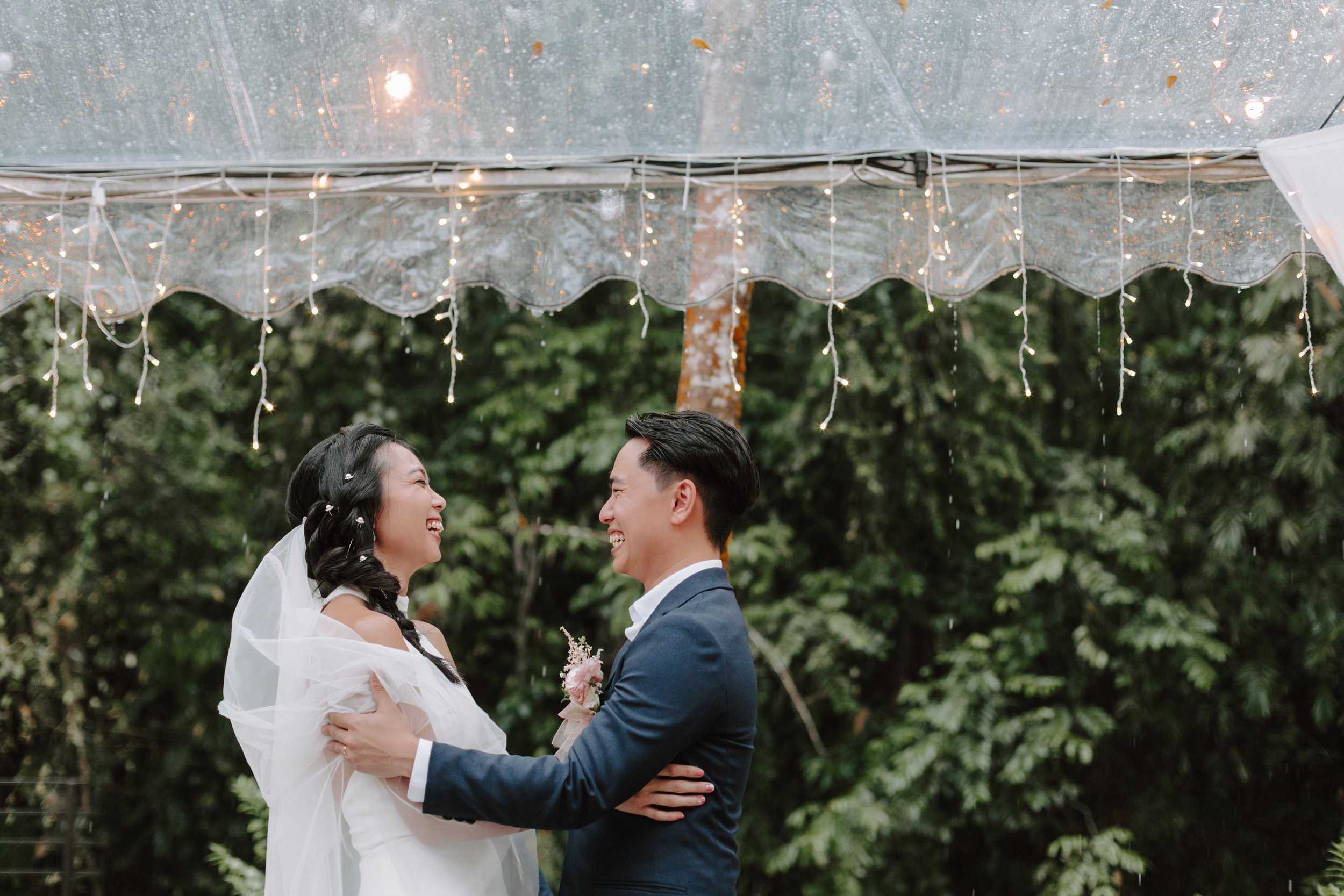 The day began bright and calm with a meaningful tea ceremony, while gentle rain arrived in the evening—leading the celebration indoors for heartfelt vows and a joyful wedding dinner at Ratu Rening Residency.