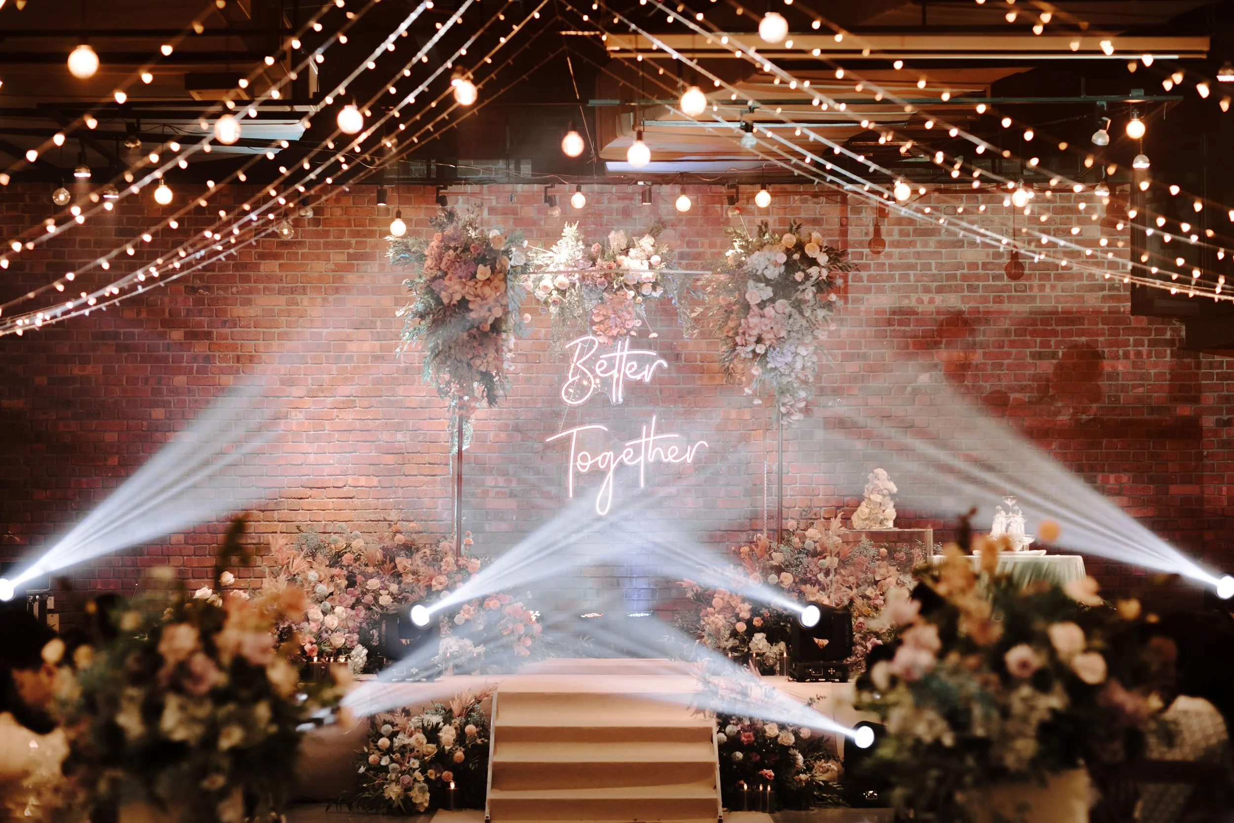A beautifully lit wedding dinner for Rhakjesh & Esther at Lightbox,with elegant decor and warm,romantic lighting.