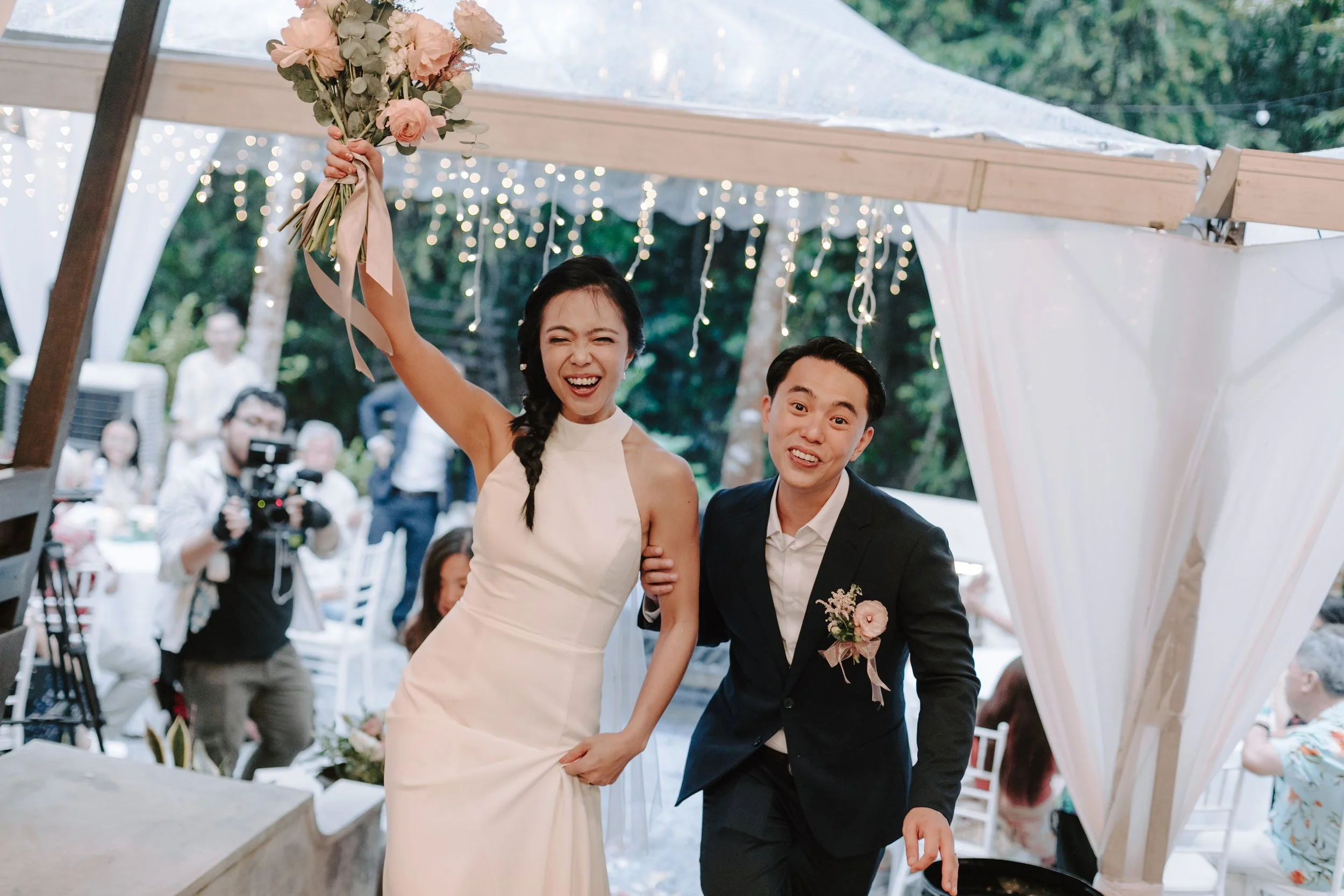 The day began bright and calm with a meaningful tea ceremony, while gentle rain arrived in the evening—leading the celebration indoors for heartfelt vows and a joyful wedding dinner at Ratu Rening Residency.