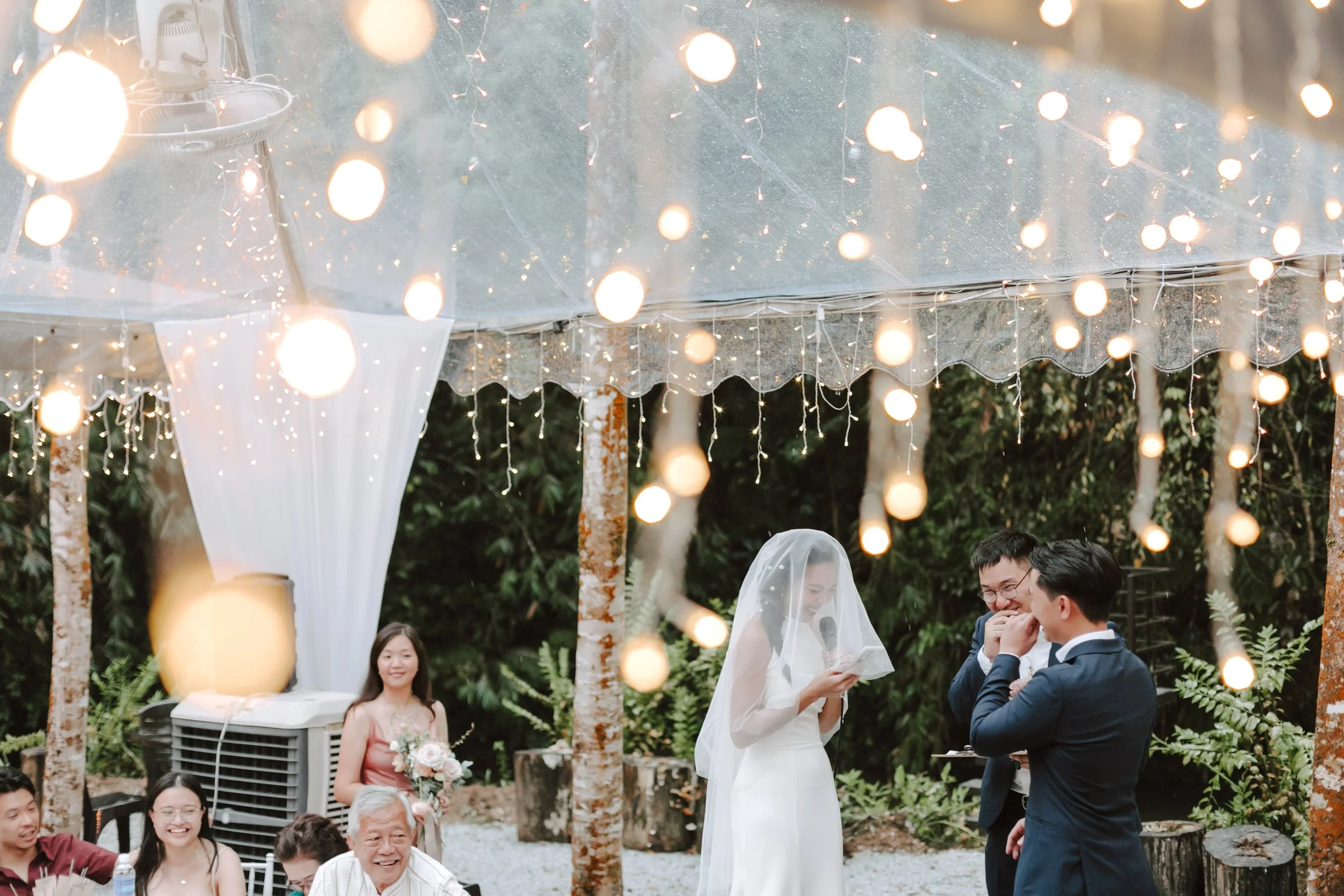 The day began bright and calm with a meaningful tea ceremony, while gentle rain arrived in the evening—leading the celebration indoors for heartfelt vows and a joyful wedding dinner at Ratu Rening Residency.