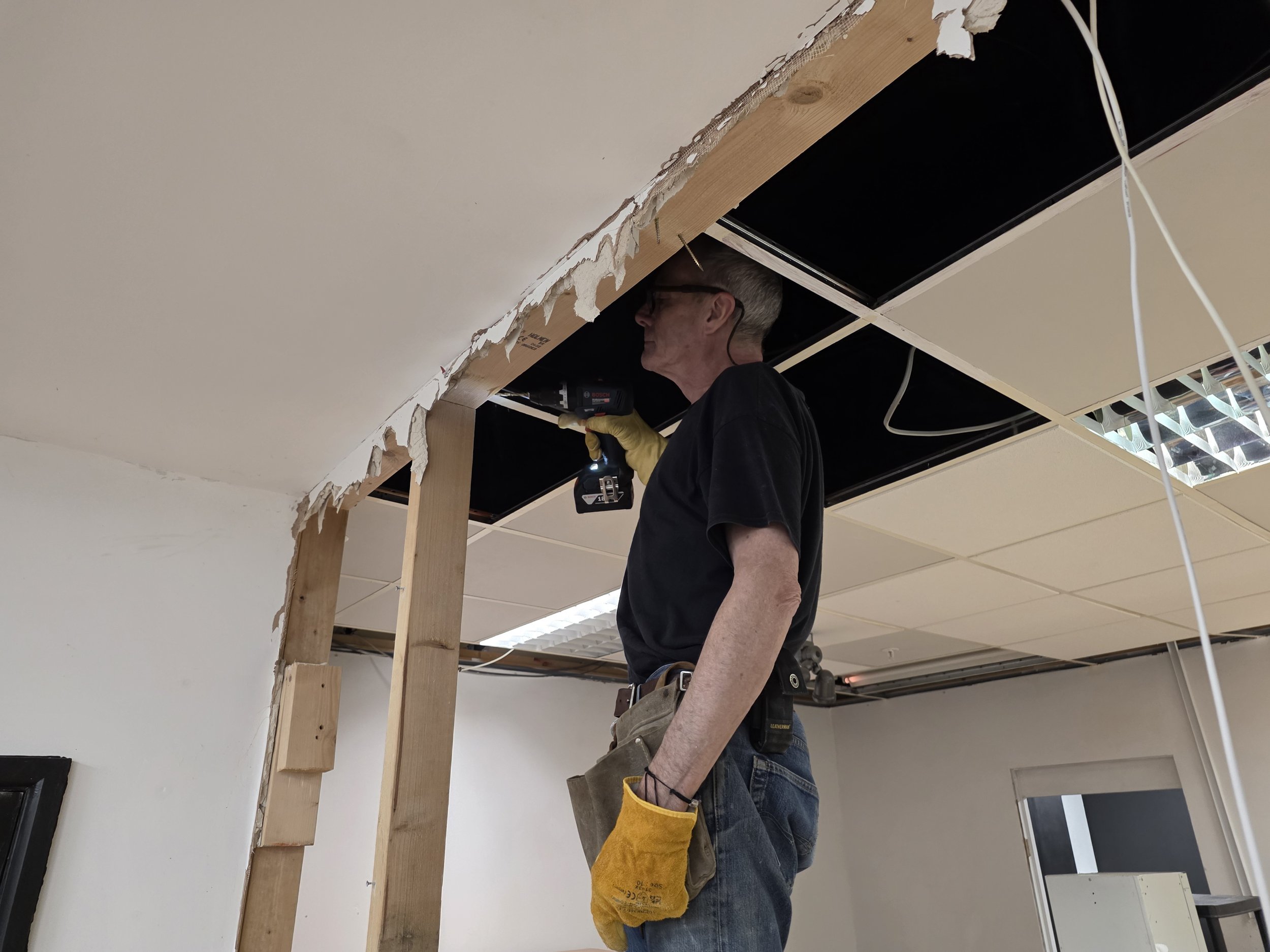 One of our KCU volunteers working hard to get the clothes shop in the Newlands Centre ready