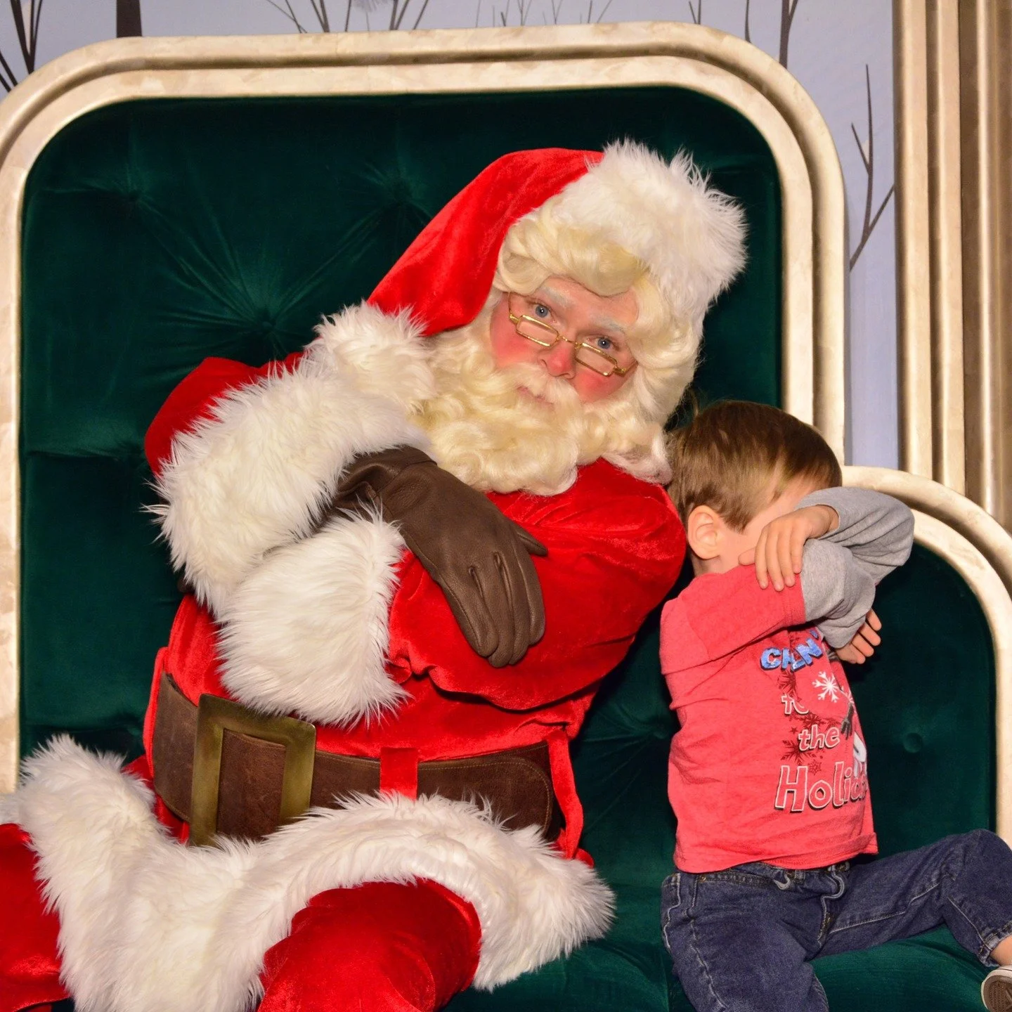 This was about 10 years ago at Disney California Adventure. Nick did not want to take a picture with Santa. This is the best photo I have ever got of him and Santa. HIlarious! I love how Santa really played along. We are still trying to make it to Di