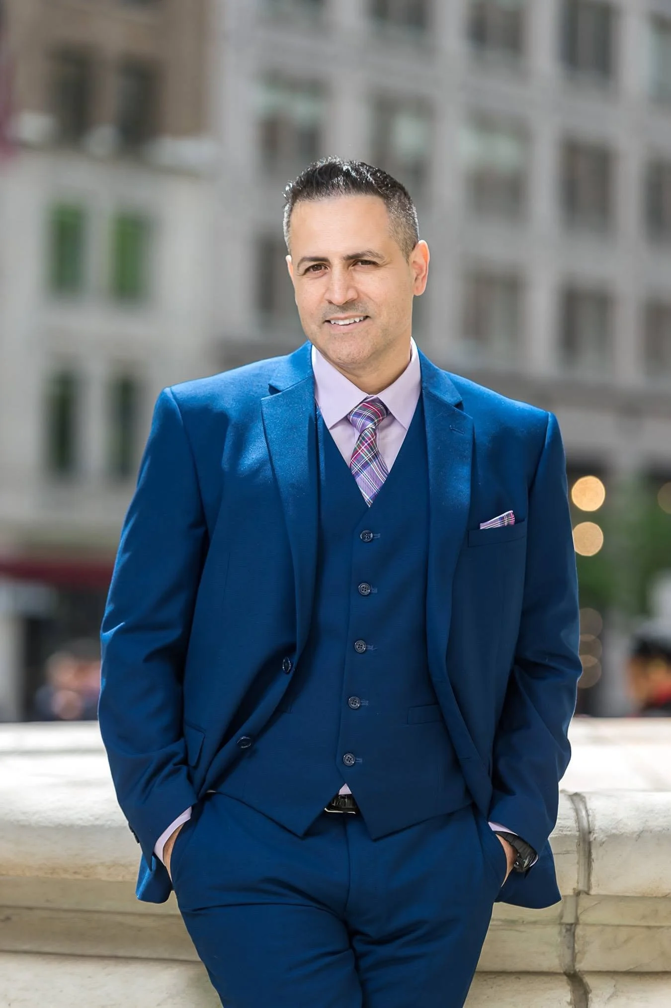 men with blue suit smiling