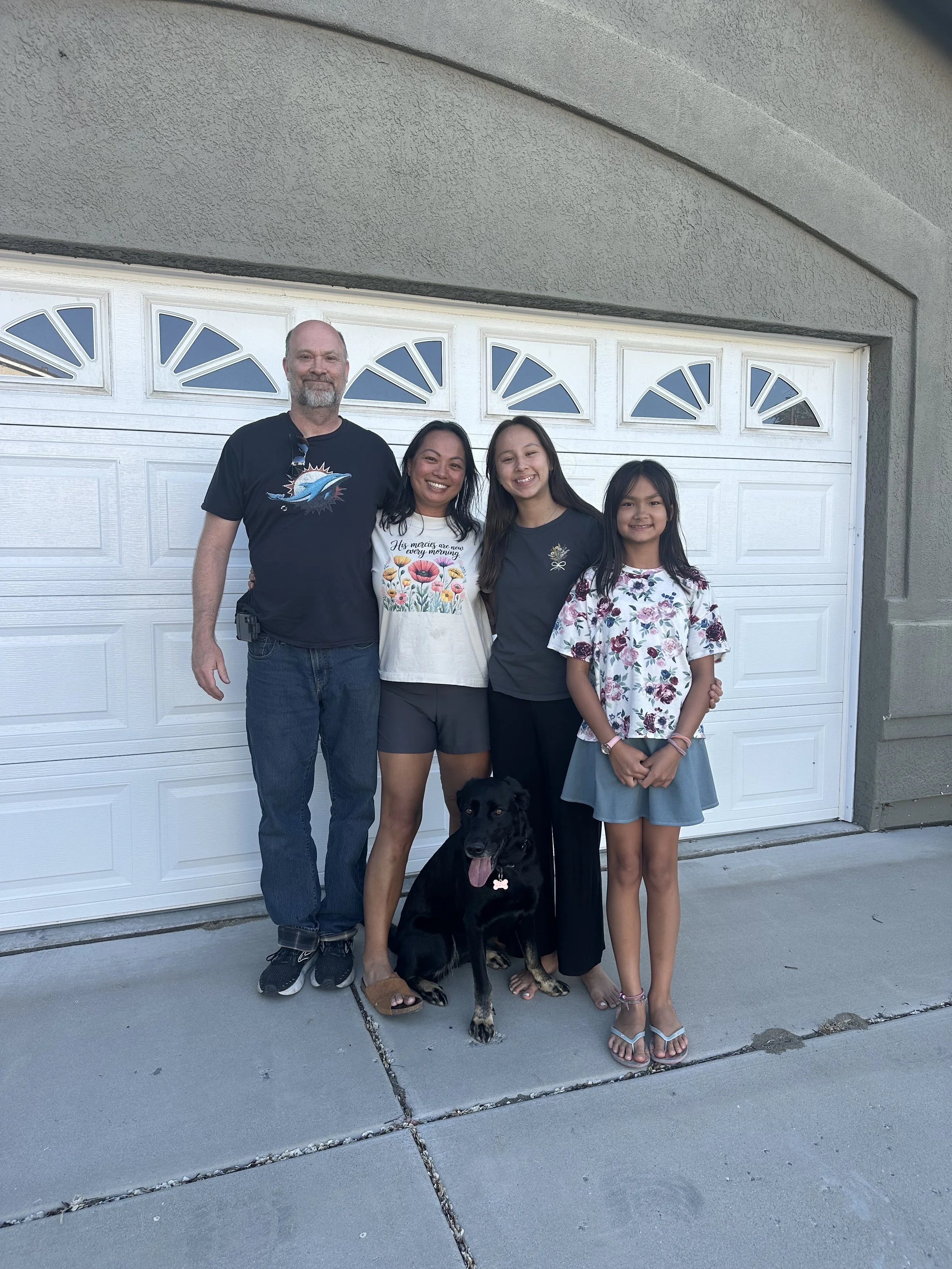 couple posing with kids after  great transaction with Lisa Williams