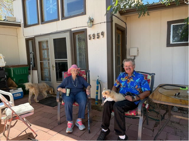 Lisa's clients sitting on their porch one last time as they close