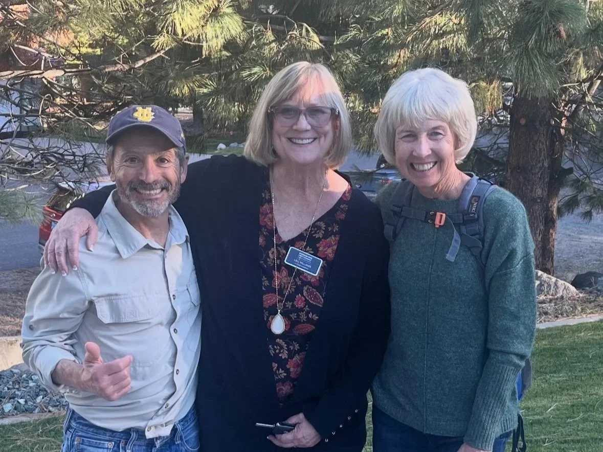 Senior couple reviewing retirement housing options with a real estate specialist in Carson City