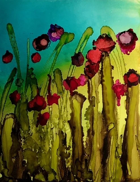 Alcohol ink painting of tall green stalks with red and purple flowers against a blue and yellow background.