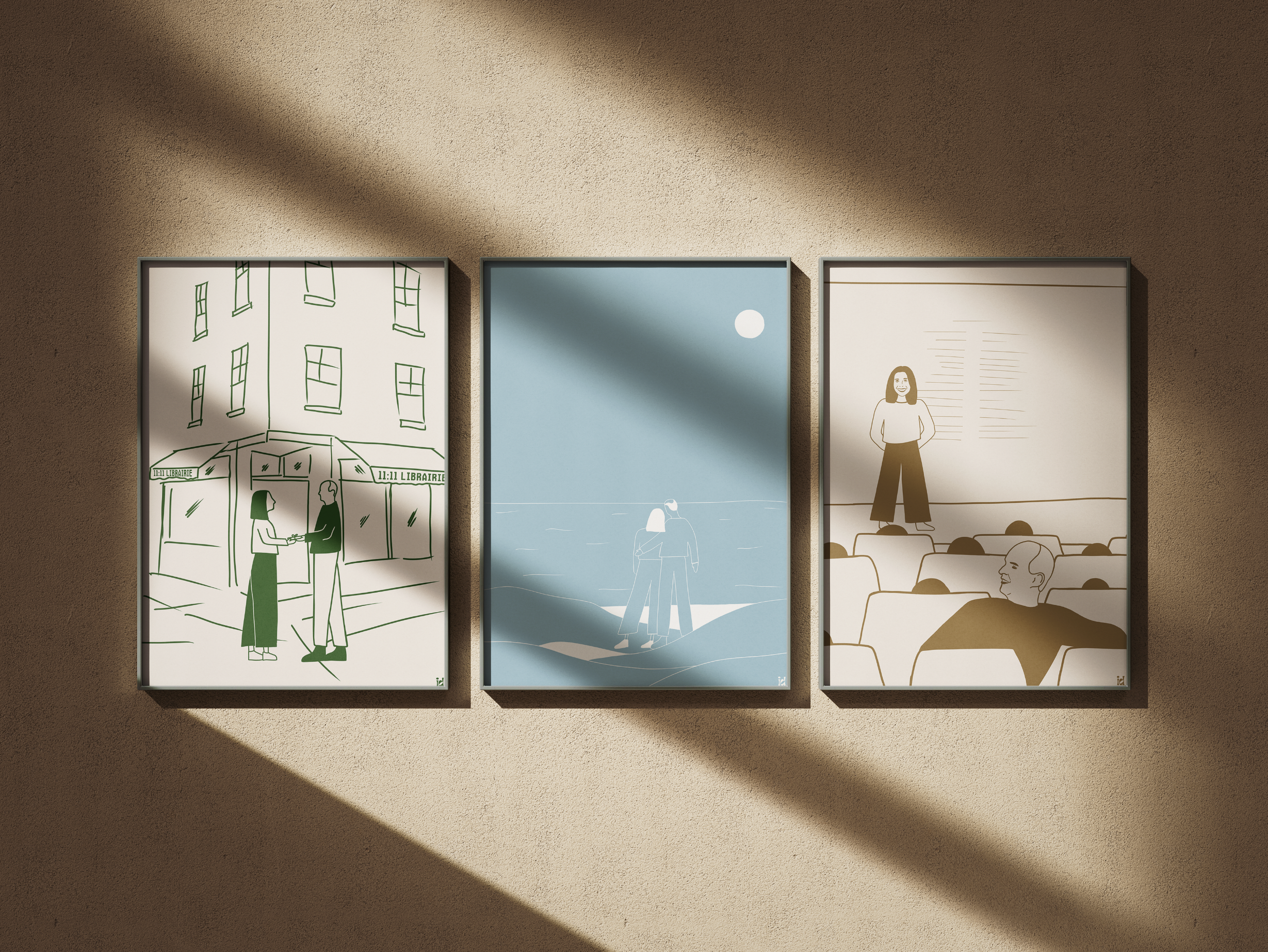 Trois illustrations encadrées accrochées au mur, représentant différentes scènes de vie, avec un jeu de lumière et d'ombre sur le mur beige.