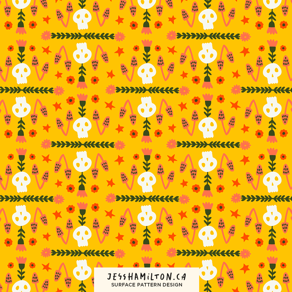 Colorful surface pattern design featuring white skulls, pink flowers, orange stars, and pink and orange plant motifs on a yellow background.