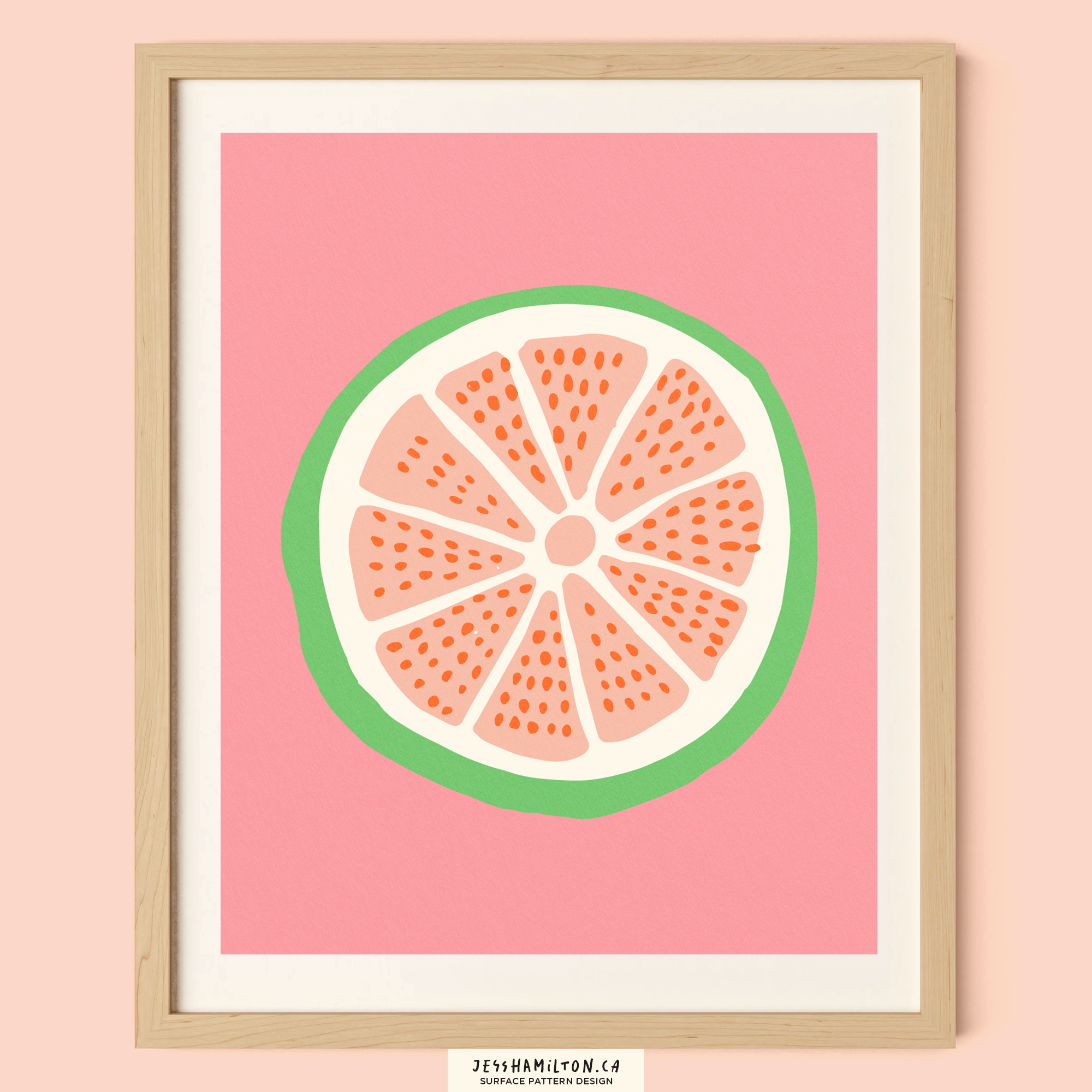 A framed digital illustration of a citrus fruit slice with a pink background, featuring a green rind and orange segments.