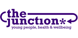 Logo for The Junction, a community organization focused on young people, health, and well-being, in purple and white text.