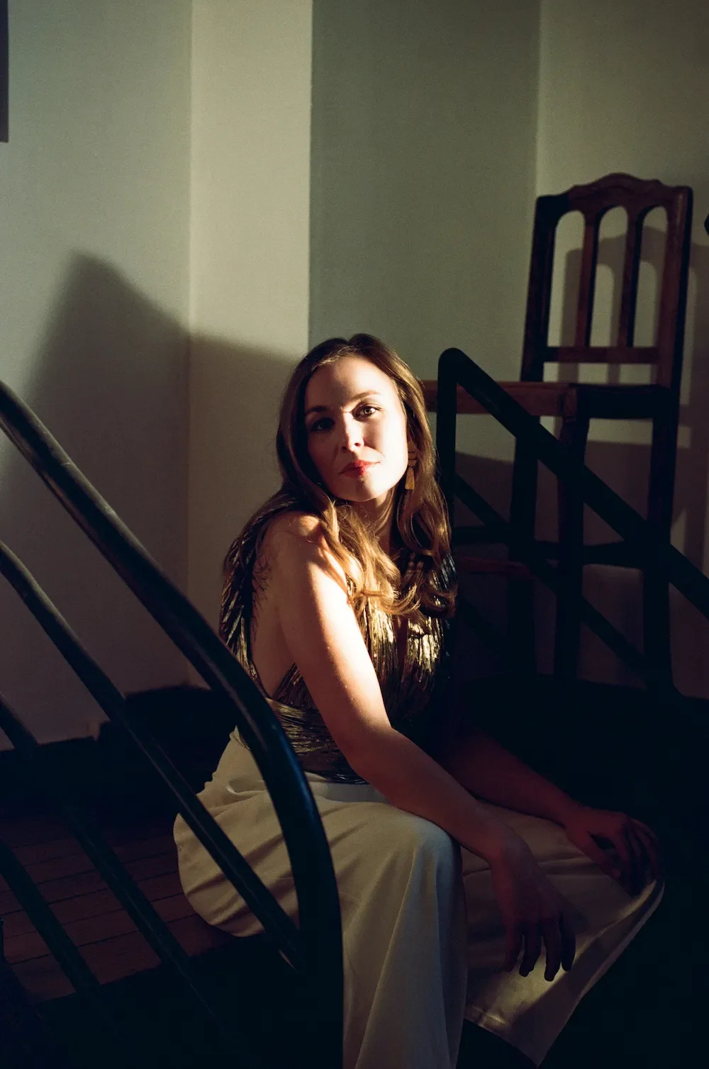 Elsa Dreisig opera soprano sitting on stairs