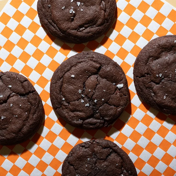 Double Shot Dark Chocolate Cookies on an orange checkered background