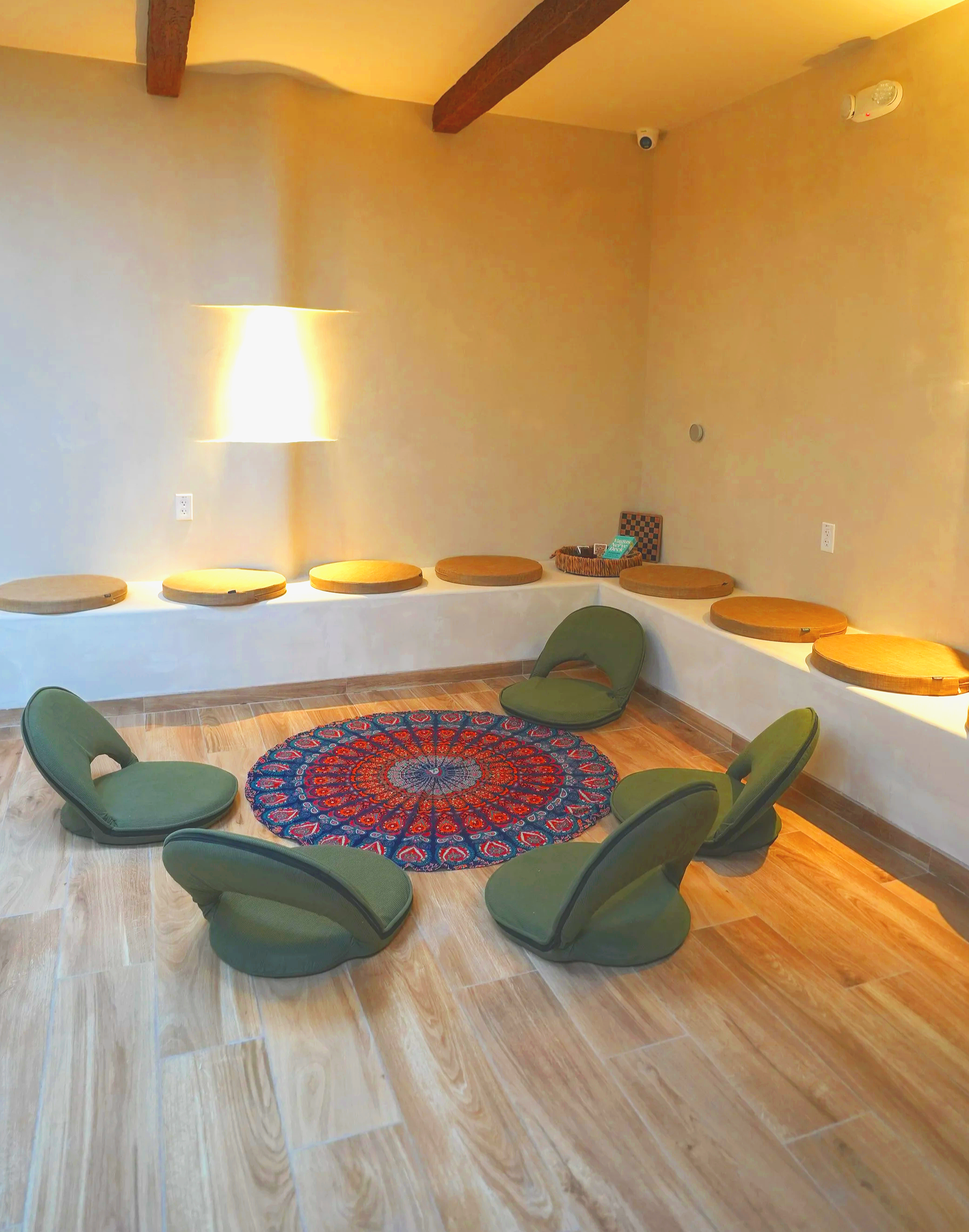 guided meditation room, group meditation space, mindfulness session room, breathwork class space, nervous system reset room, wellness group session