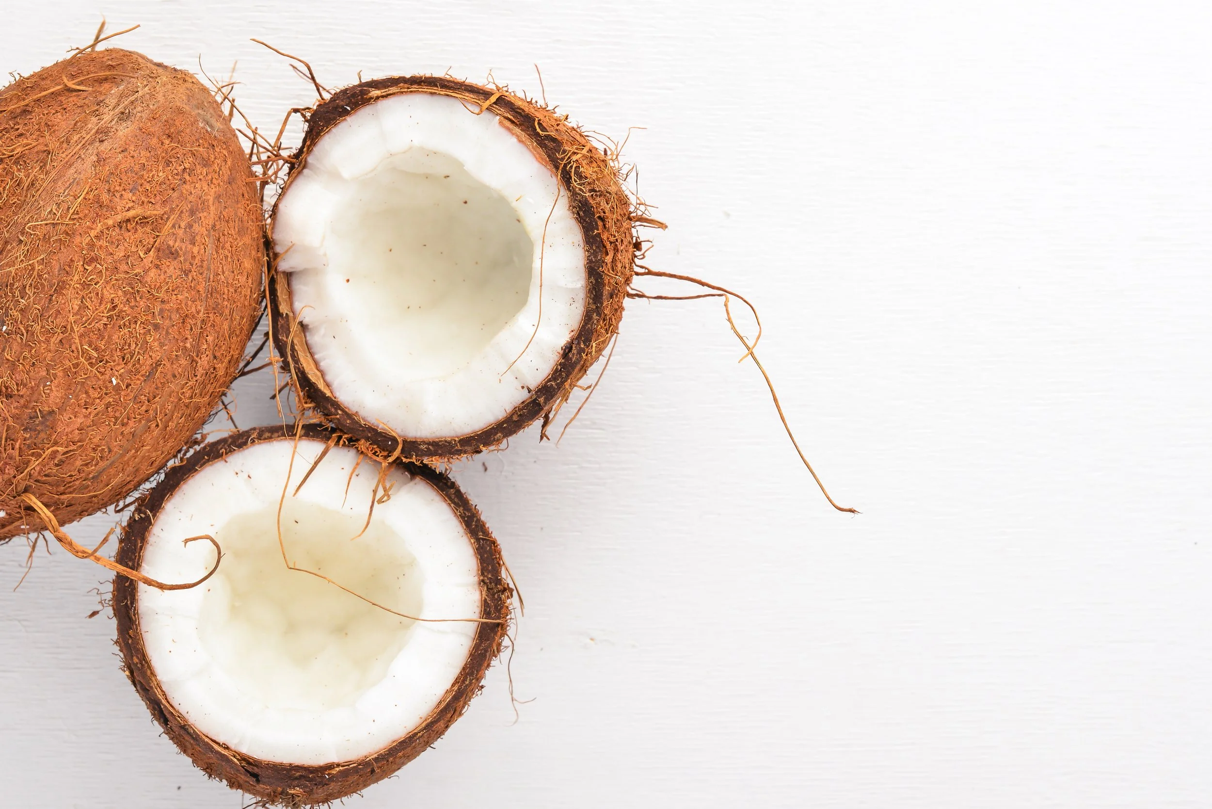 coconut-wooden-background-tropical-fruits-nuts-top-view-free-space-text.jpg