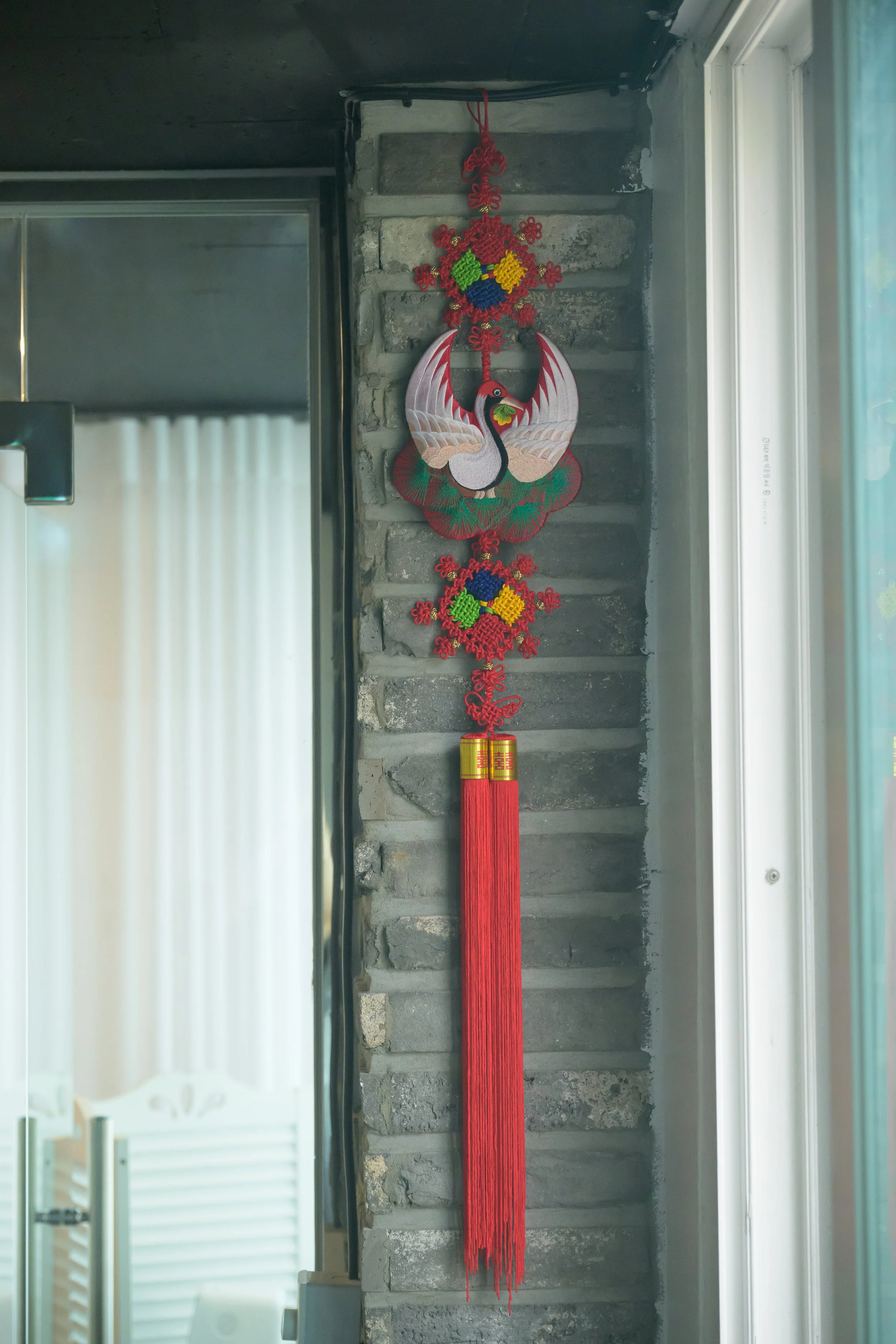 Traditional Korean crane decoration displayed inside Laurel Studio, reflecting Korean culture and aesthetic beauty.