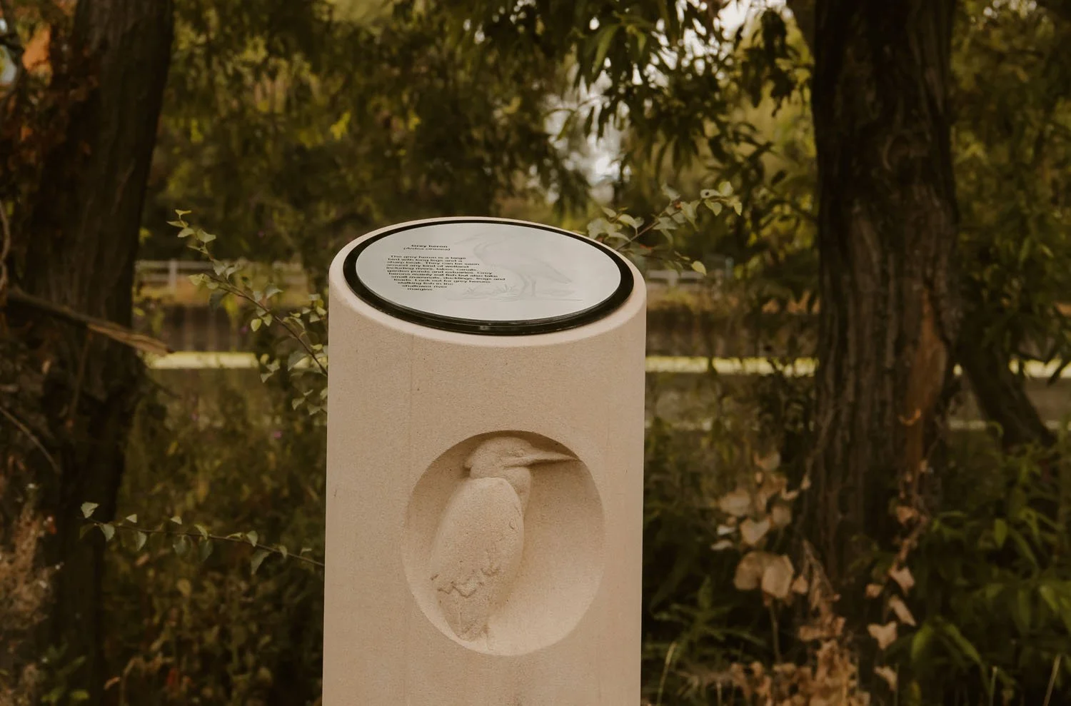 Stone column carved with a Heron as part of the Arup Architects commission