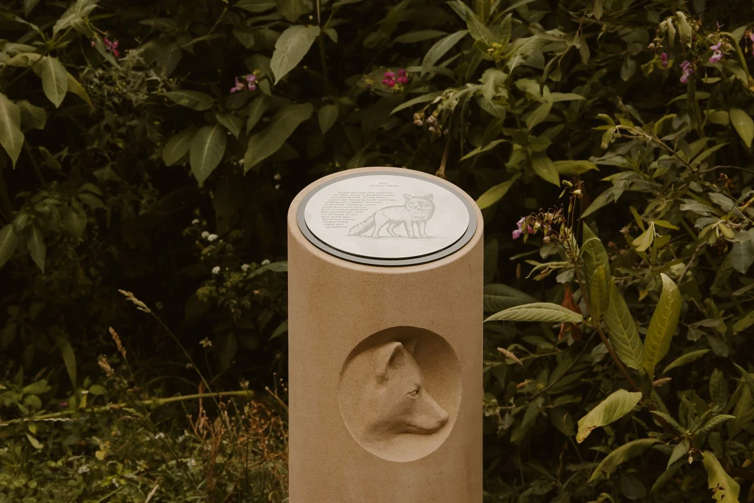 Carved stone column with Fox for the Arup Architects Memorial Walk commission