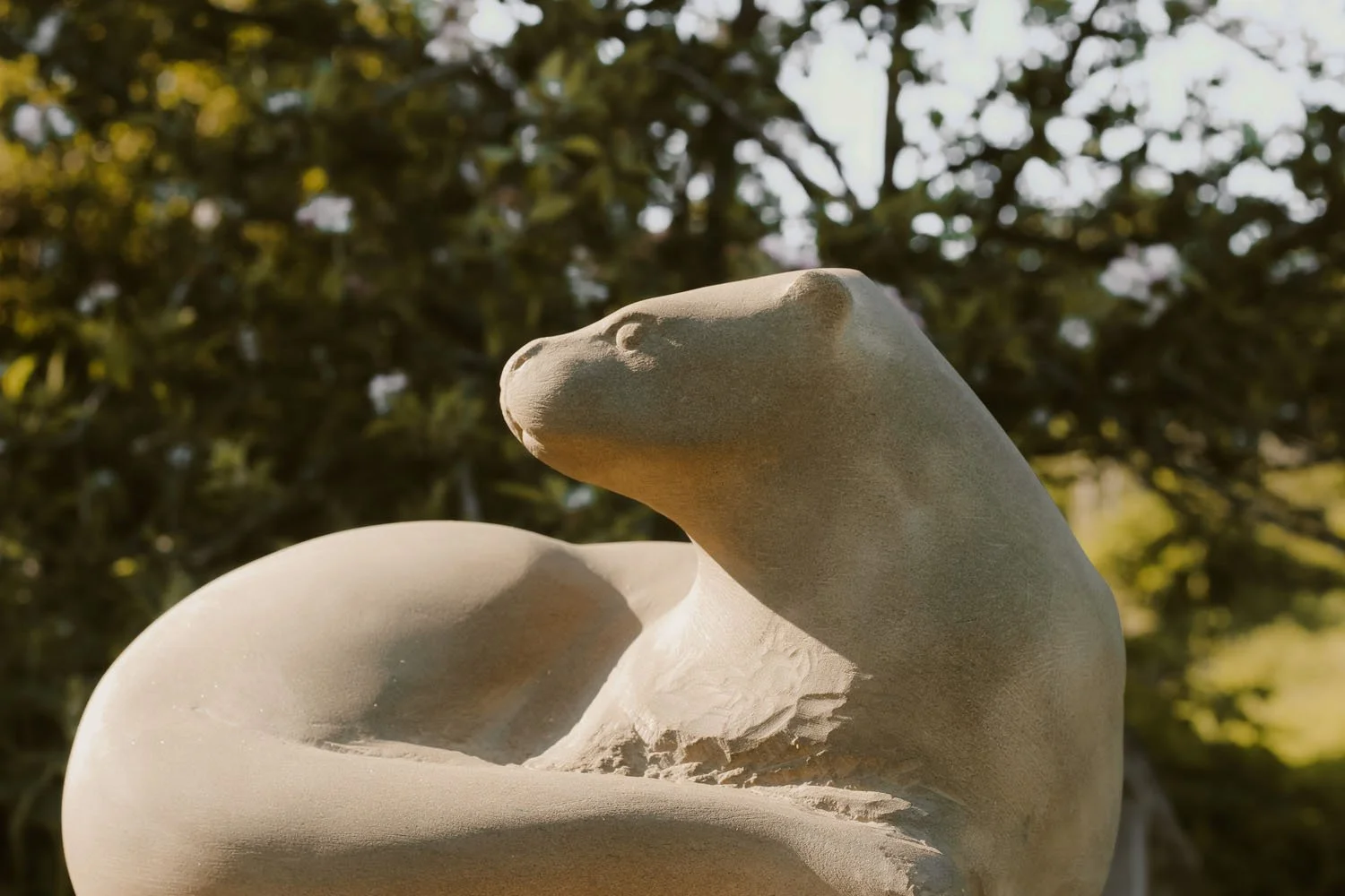 Completing the resting Otter stone sculpture